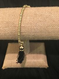 Gold bead with black tassel bracelet //269